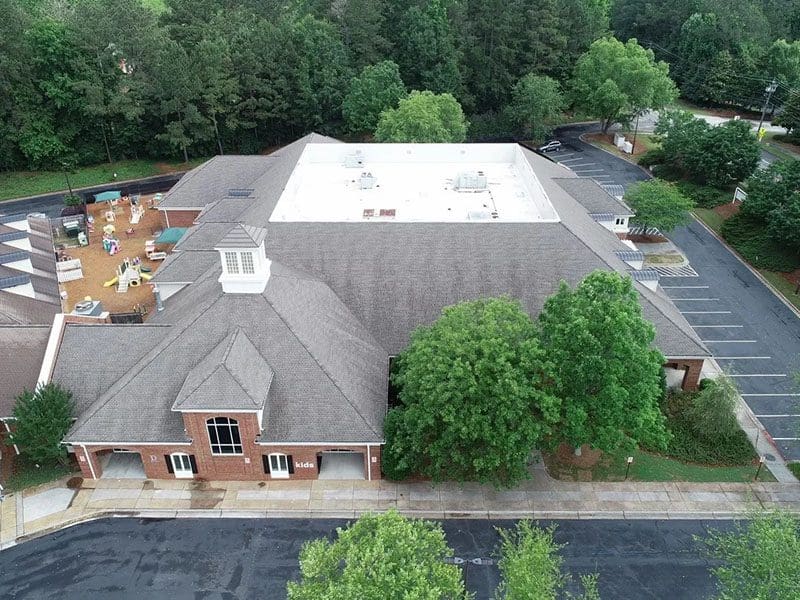 A large building with trees in the background